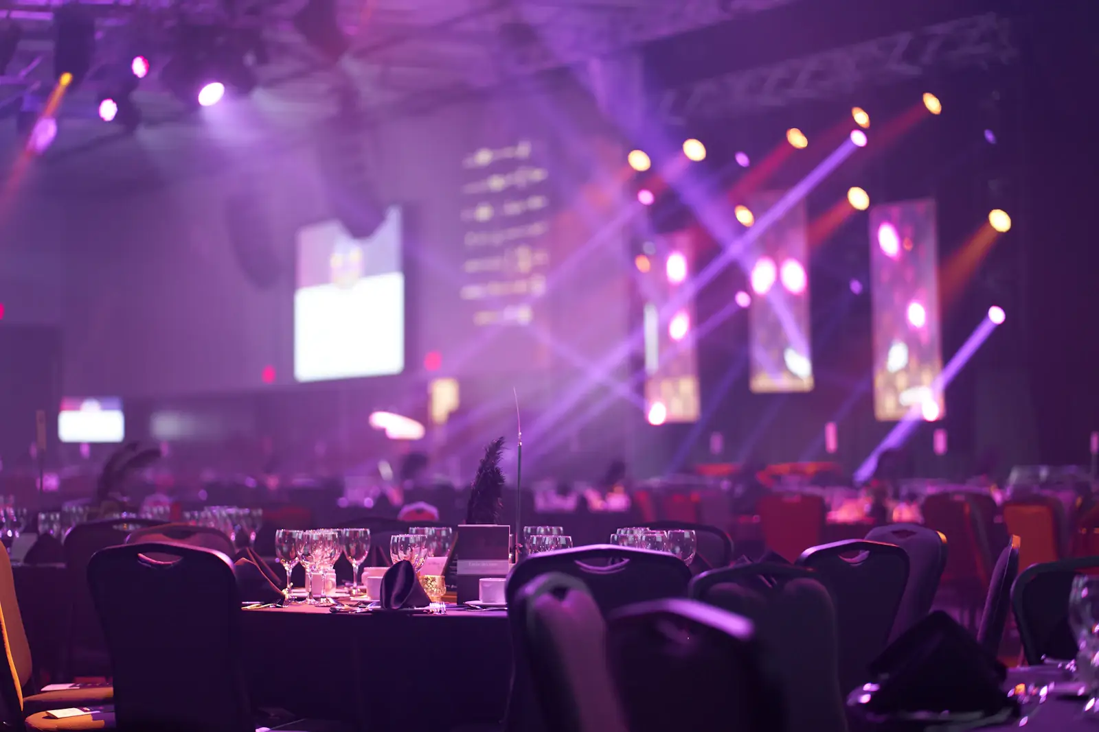 Gala dinner room washed in violet stage lighting